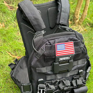 Feyachi TM-20 Magnetic Tactical Vest displayed on grass with shoulder straps visible.