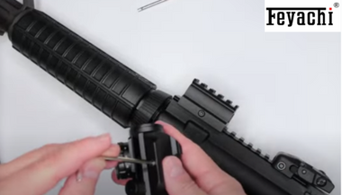 Mounting Feyachi red dot sight on rifle for improved performance.